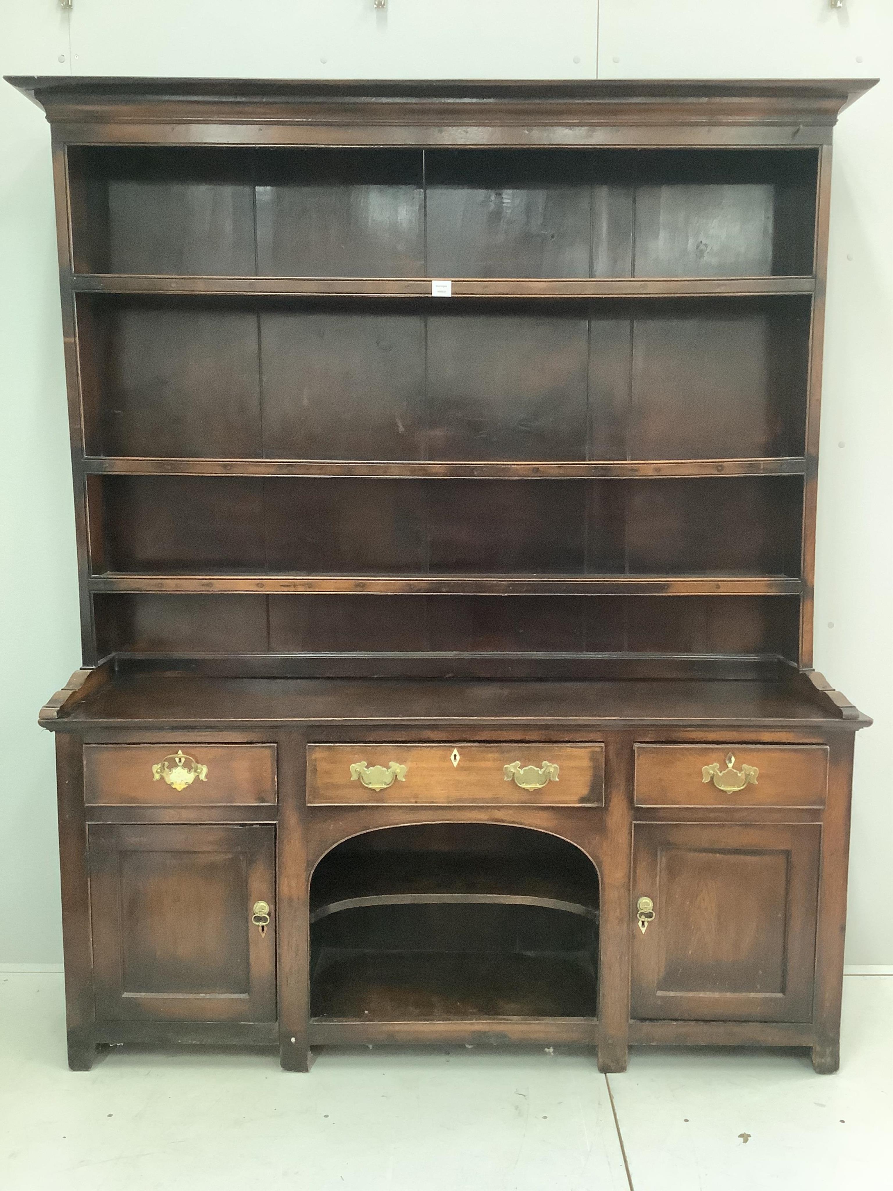 A mid 18th century oak dog kennel dresser with boarded rack, width 170cm, depth 41cm, height 207cm. Condition - fair